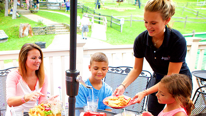 Summer waitstaff serving family food