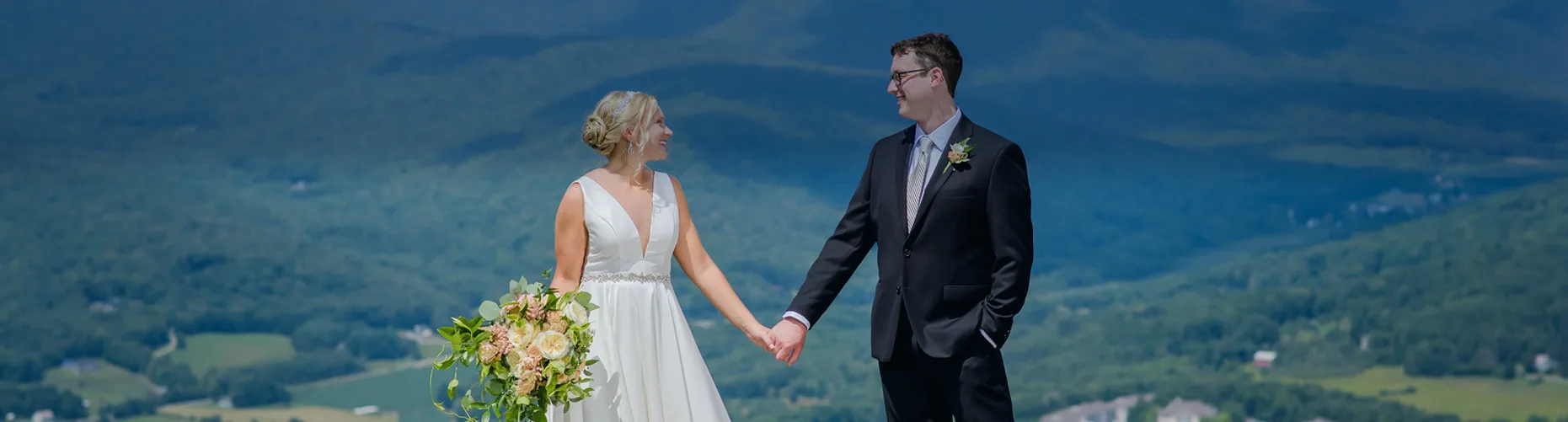Wedding couple at top of Jiminy Peak